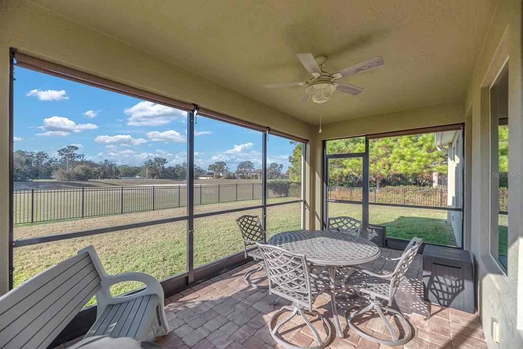 6230 Plover Meadow Street Lithia, FL 33547 - Photo 2 of 50 a view of a patio with a table chairs and a table