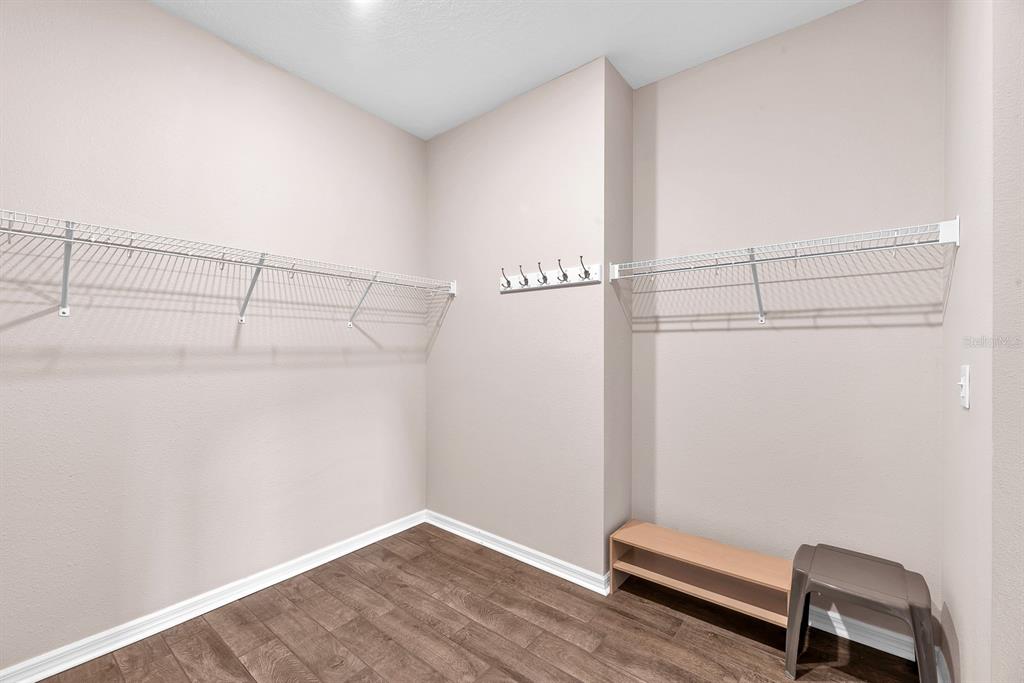 6230 Plover Meadow Street Lithia, FL 33547 - Photo 25 of 50 a view of a room with racks on the wall