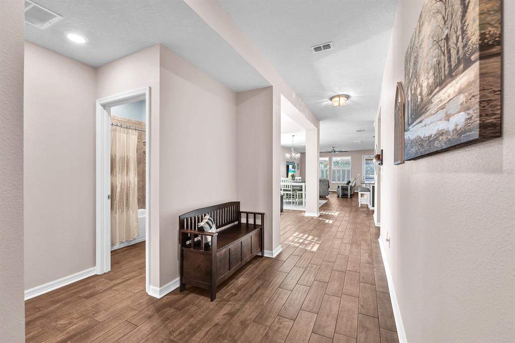 6230 Plover Meadow Street Lithia, FL 33547 - Photo 26 of 50 a view of a living room with a wooden floor