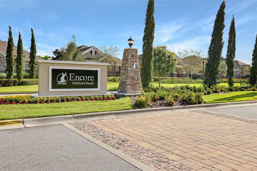 6230 Plover Meadow Street Lithia, FL 33547 - Photo 37 of 50 a sign on the side of a street