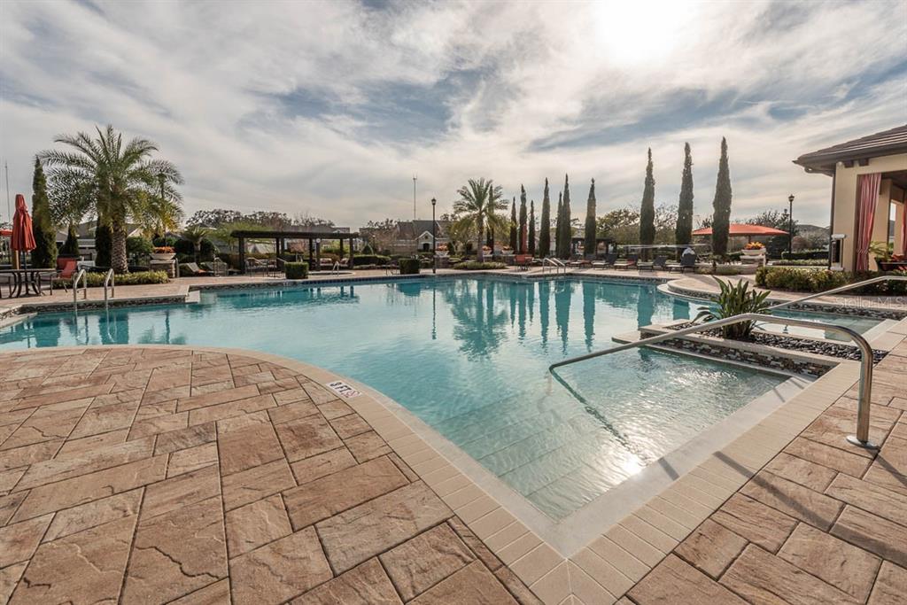 6230 Plover Meadow Street Lithia, FL 33547 - Photo 44 of 50 a view of a swimming pool with outdoor seating