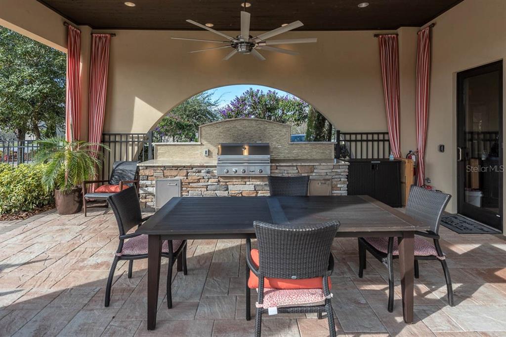 6230 Plover Meadow Street Lithia, FL 33547 - Photo 46 of 50 a balcony with table and chairs