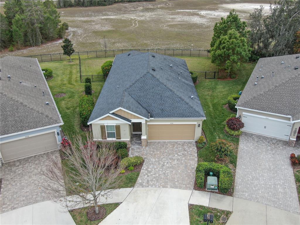 6230 Plover Meadow Street Lithia, FL 33547 - Photo 6 of 50 an aerial view of a house with a garden and plants
