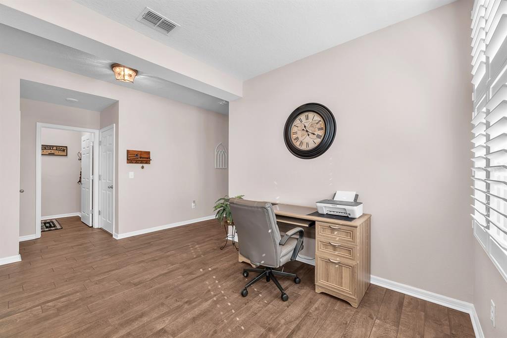 6230 Plover Meadow Street Lithia, FL 33547 - Photo 9 of 50 a view of a workspace with furniture and a window