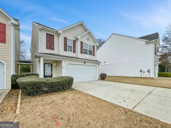 a front view of a house with a yard