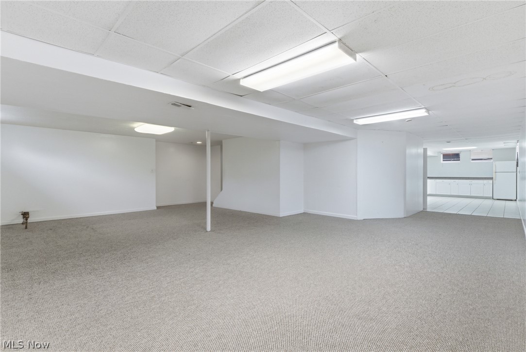 11678 Dunham Road Northfield, OH 44067 - Photo 29 of 38 Spacious lower level featuring carpeted flooring and an open layout