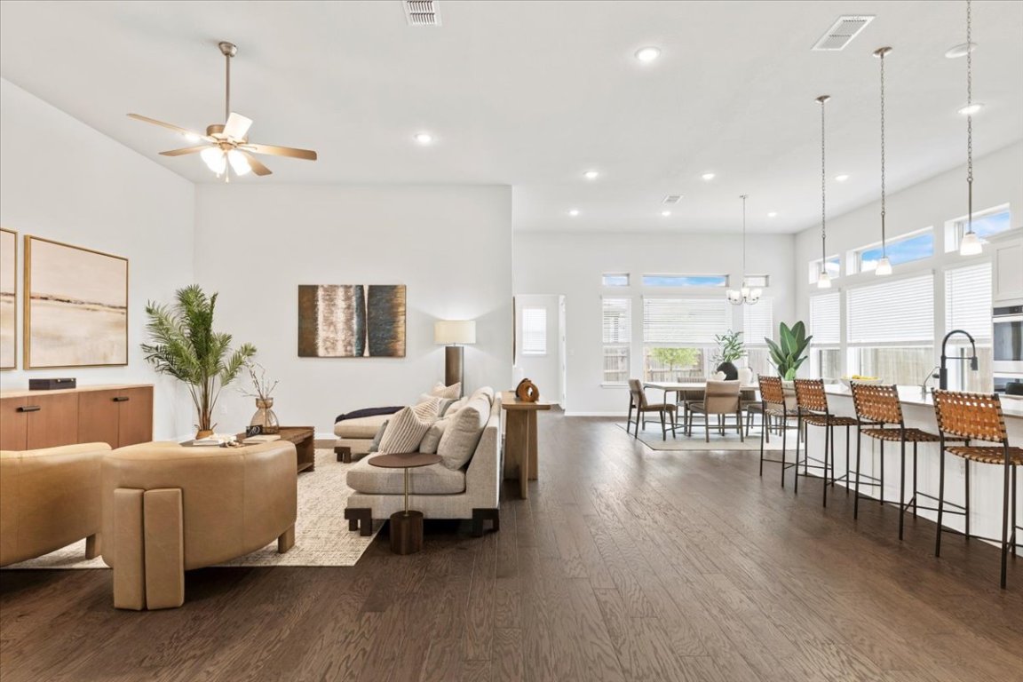 271 Eclipse Drive, Unit 67 Austin, TX 78737 - Photo 1 of 39 a living room with furniture or wooden floor and a chandelier