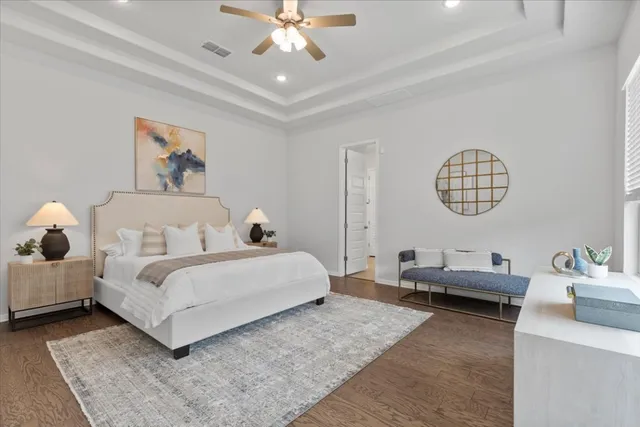 a living room with bed and a chandelier