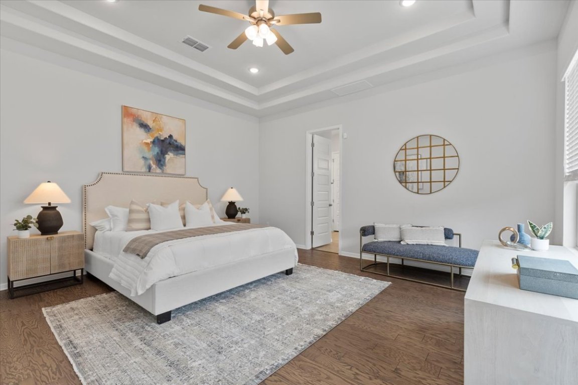 271 Eclipse Drive, Unit 67 Austin, TX 78737 - Photo 12 of 39 a living room with bed and a chandelier