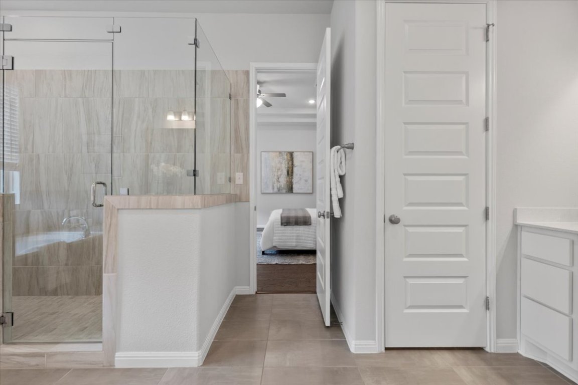 271 Eclipse Drive, Unit 67 Austin, TX 78737 - Photo 17 of 39 a en suite bathroom with a shower