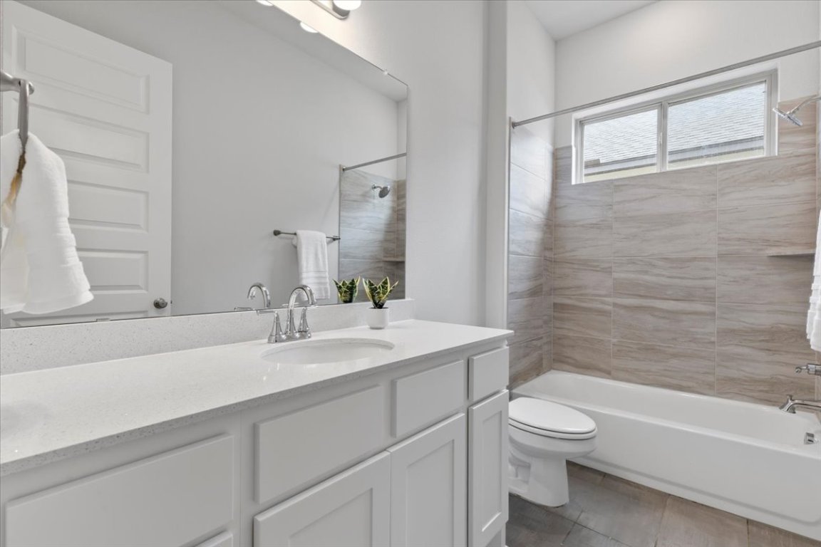 271 Eclipse Drive, Unit 67 Austin, TX 78737 - Photo 22 of 39 a bathroom with a sink a toilet and shower