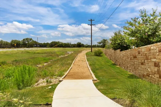 a view of a lake with a yard