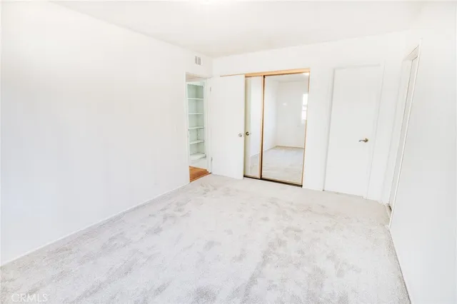 a bathroom with a sink vanity mirror and toilet
