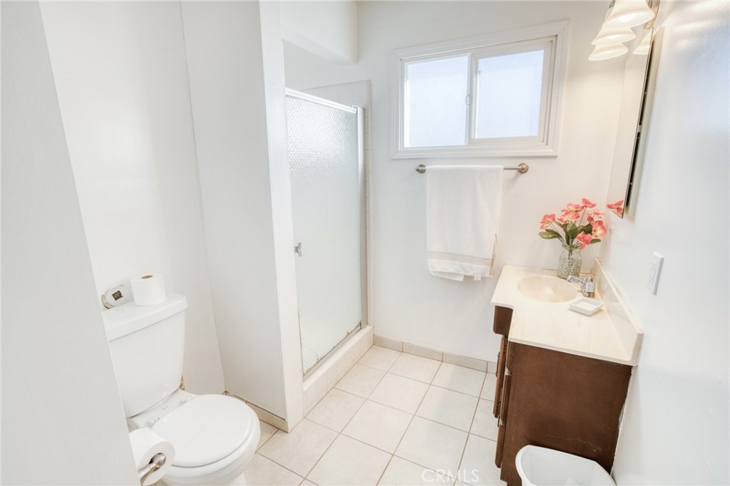 740 Walnut Lane Santa Barbara, CA 93111 - Photo 18 of 28 a bathroom with a sink vanity mirror and toilet