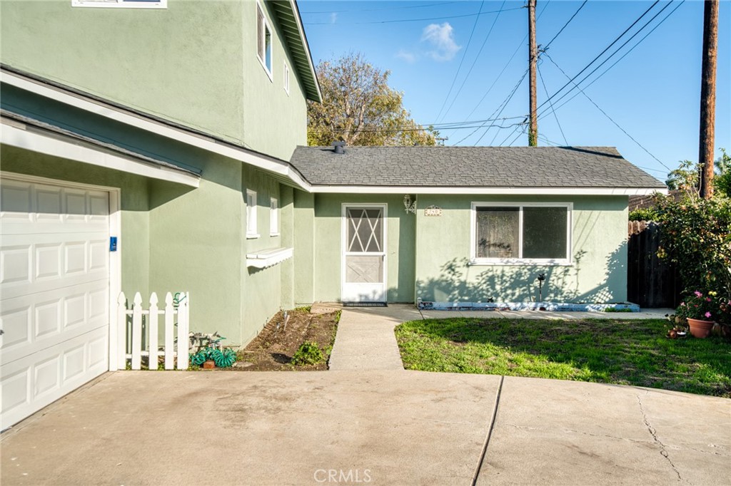 740 Walnut Lane Santa Barbara, CA 93111 - Photo 2 of 28 a front view of a house with a garden and yard