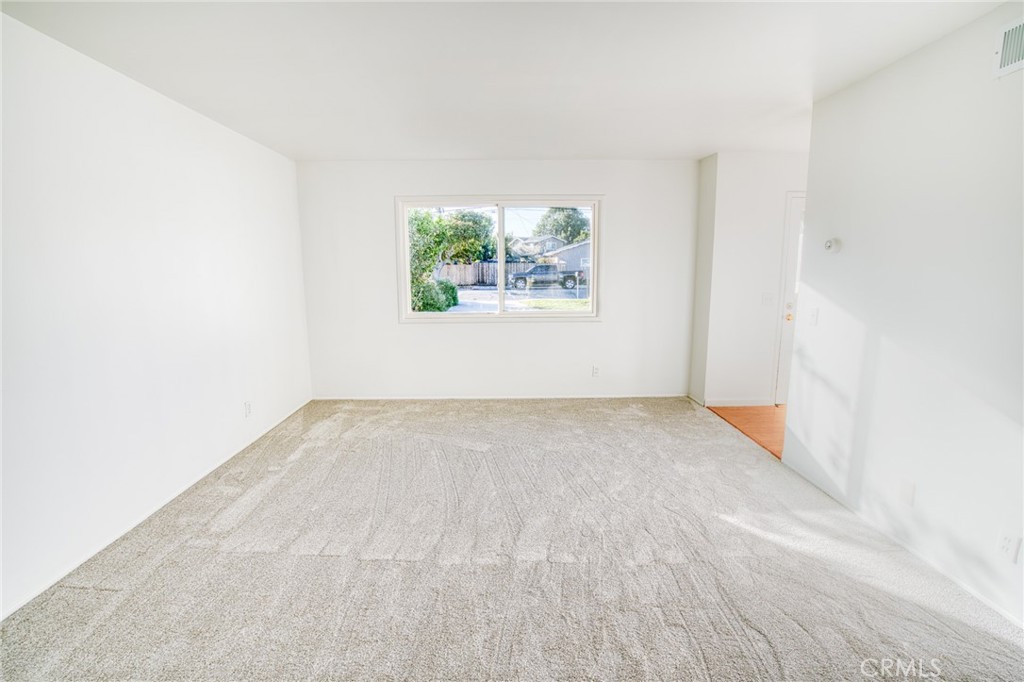 740 Walnut Lane Santa Barbara, CA 93111 - Photo 4 of 28 a view of a big room with wooden floor and a window