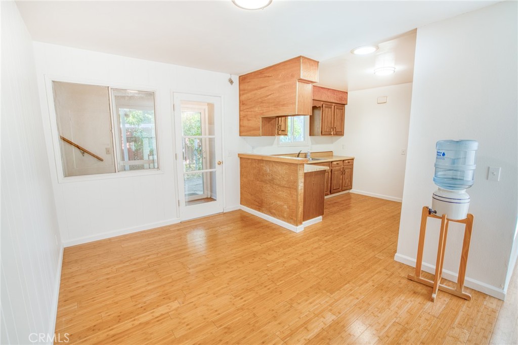 740 Walnut Lane Santa Barbara, CA 93111 - Photo 7 of 28 a large white kitchen with stainless steel appliances granite countertop a refrigerator and a stove top oven