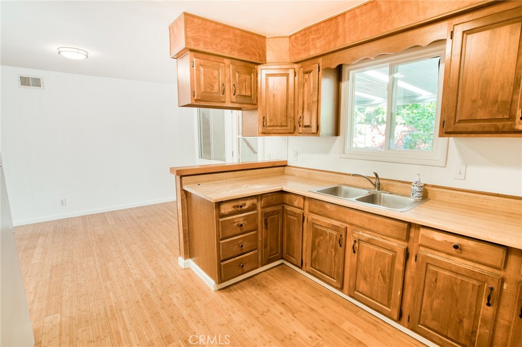 740 Walnut Lane Santa Barbara, CA 93111 - Photo 9 of 28 a kitchen with stainless steel appliances granite countertop a sink and a cabinets
