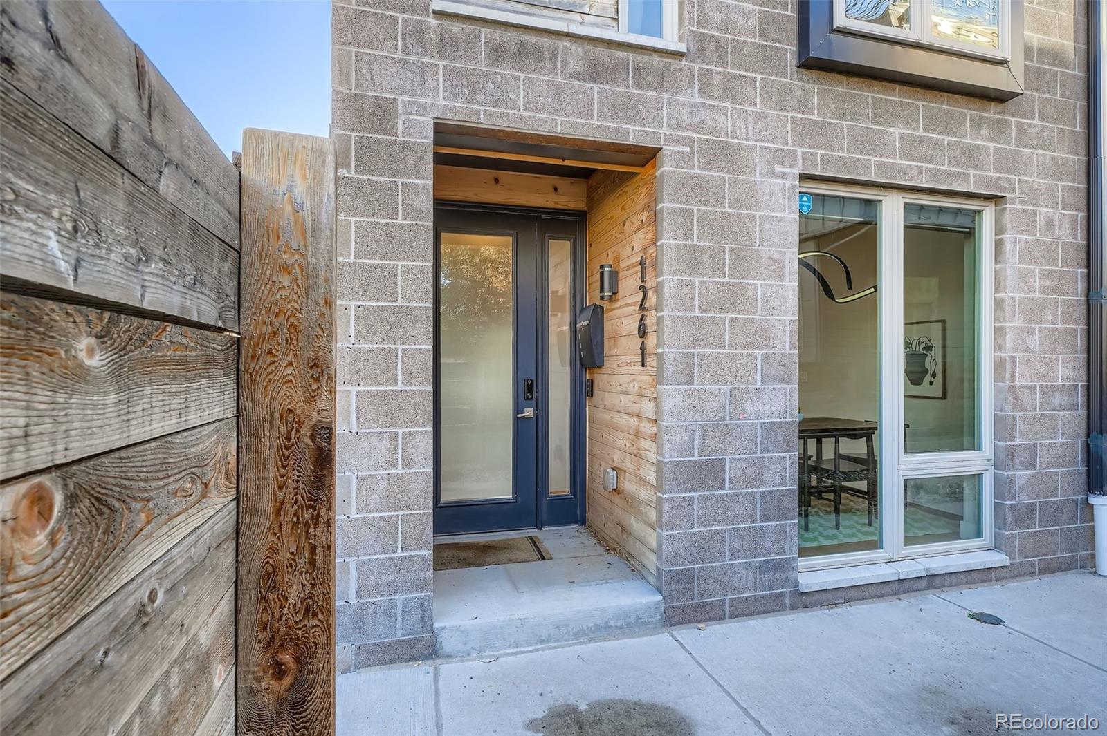 1261 Xavier Street Denver, CO 80204 - Photo 20 of 27 a view of a brick house with a large door
