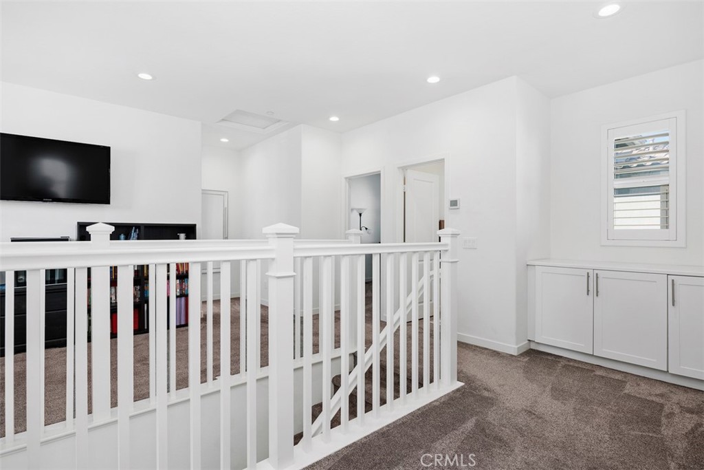 4130 Via Del Rey Oceanside, CA 92057 - Photo 11 of 35 a view of a hallway with a flat screen tv