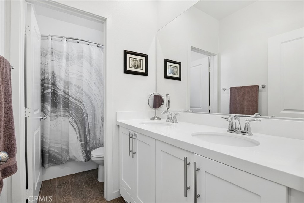 4130 Via Del Rey Oceanside, CA 92057 - Photo 19 of 35 a bathroom with a double vanity sink mirror and shower