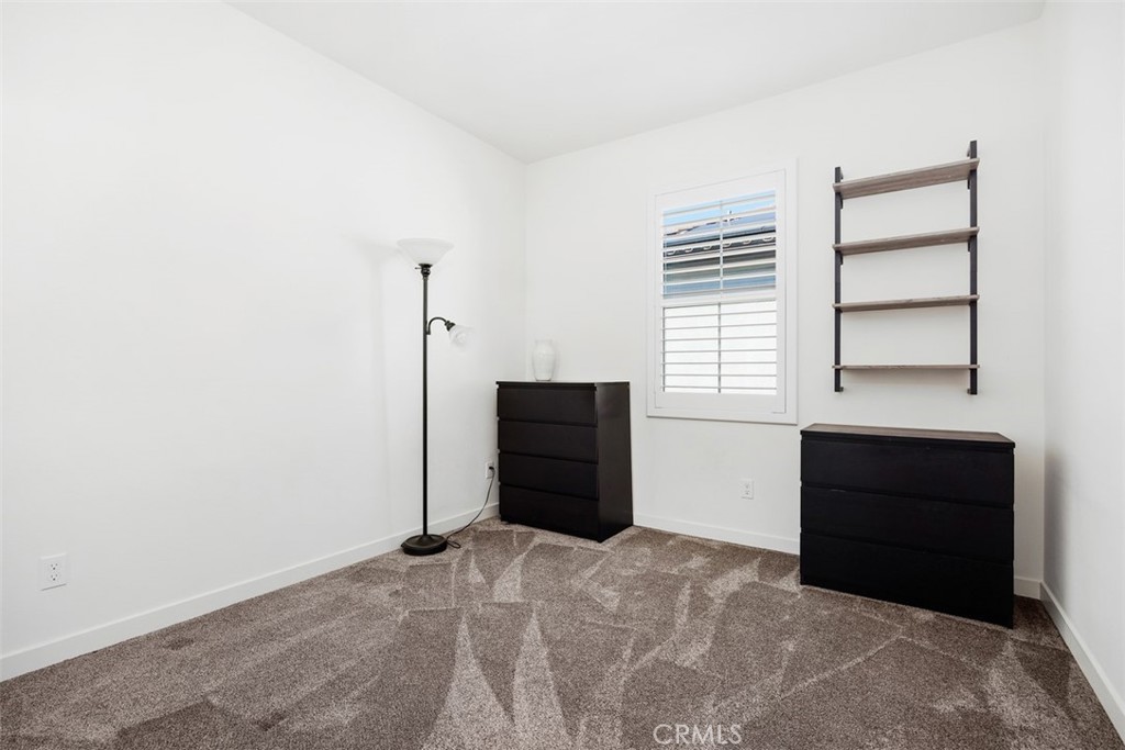 4130 Via Del Rey Oceanside, CA 92057 - Photo 21 of 35 a living room with a dresser and a window