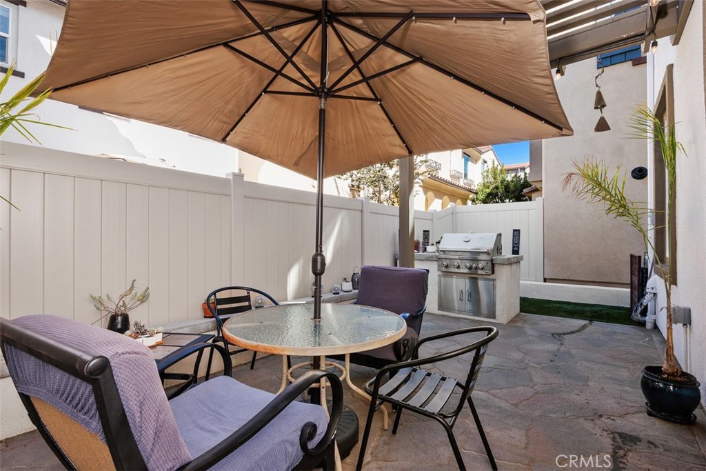 4130 Via Del Rey Oceanside, CA 92057 - Photo 22 of 35 a patio with a table and chairs