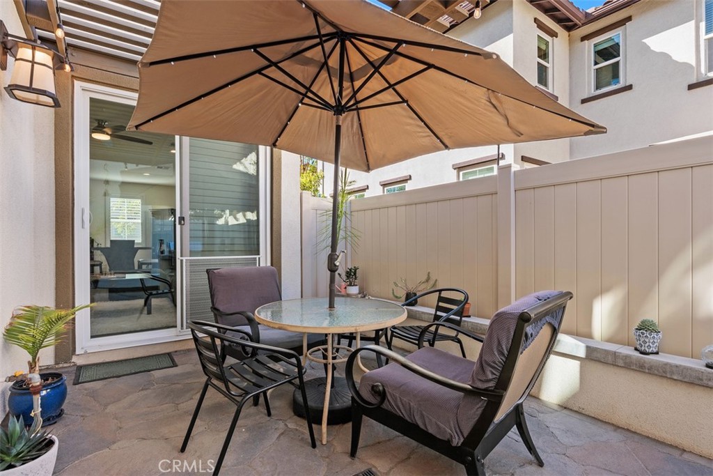 4130 Via Del Rey Oceanside, CA 92057 - Photo 23 of 35 a view of a patio with furniture and table under an umbrella