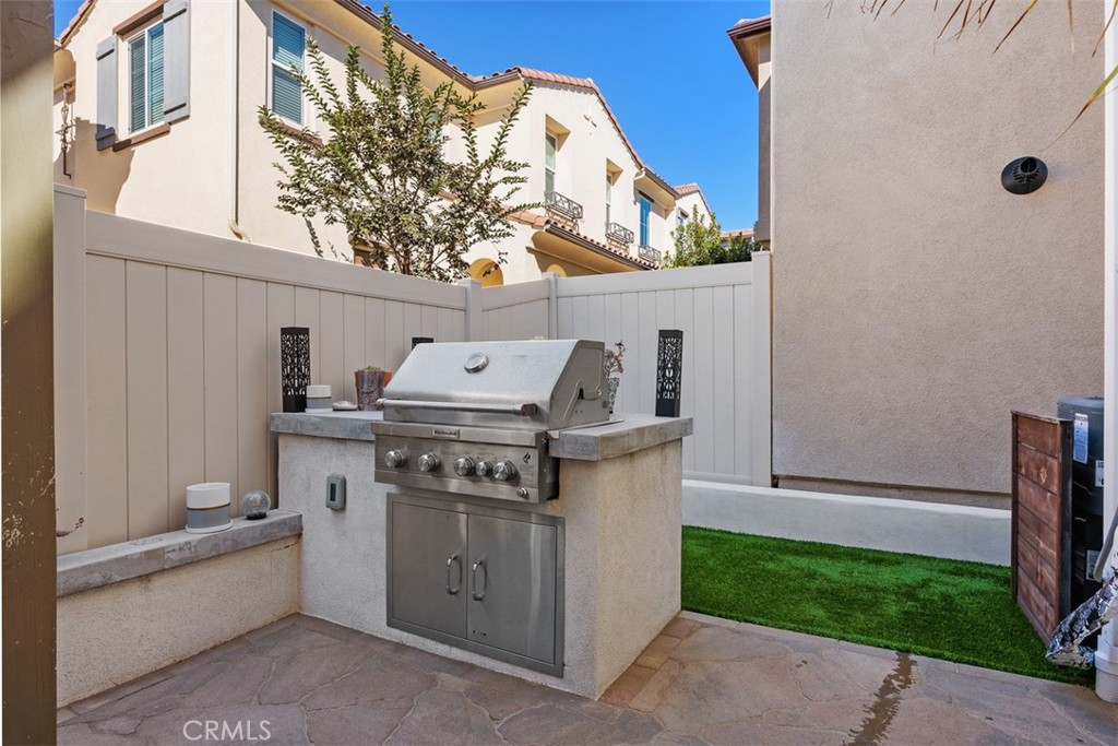 4130 Via Del Rey Oceanside, CA 92057 - Photo 24 of 35 a white stove sitting next to a white house