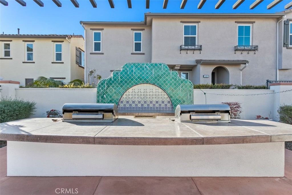 4130 Via Del Rey Oceanside, CA 92057 - Photo 28 of 35 a white building with a sink and yard in front of it