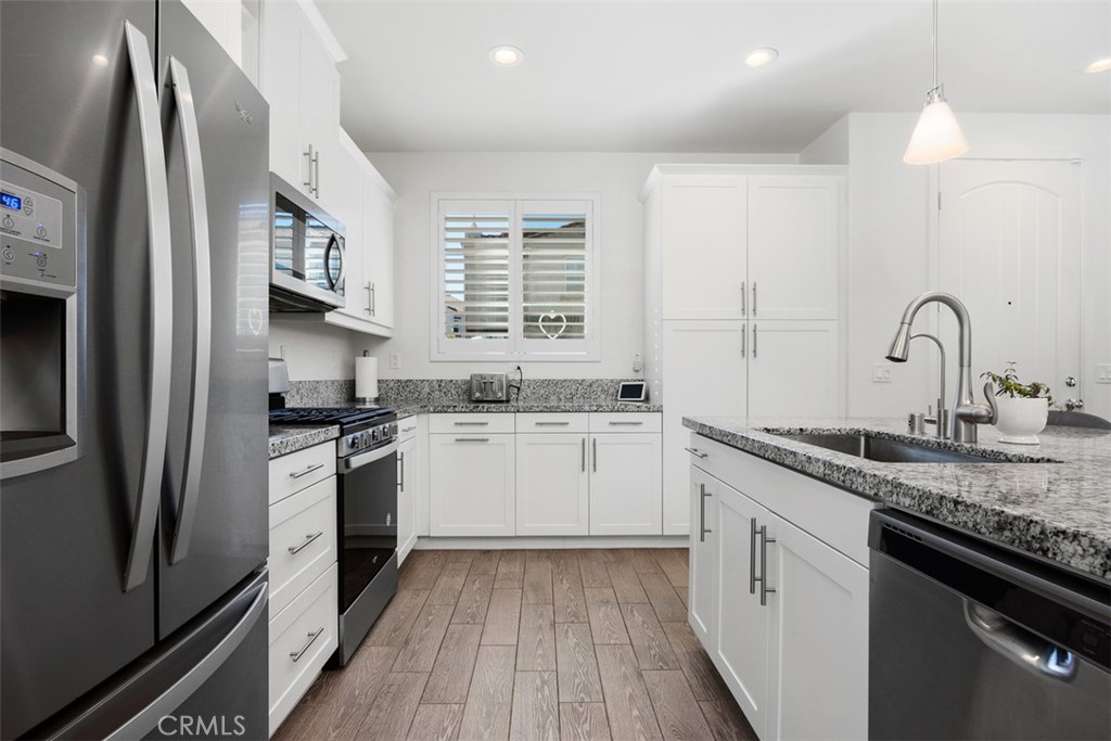 4130 Via Del Rey Oceanside, CA 92057 - Photo 6 of 35 a kitchen with a sink stove and refrigerator
