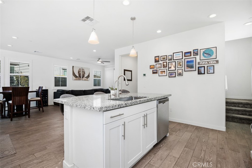 4130 Via Del Rey Oceanside, CA 92057 - Photo 8 of 35 a kitchen with granite countertop a sink and cabinets