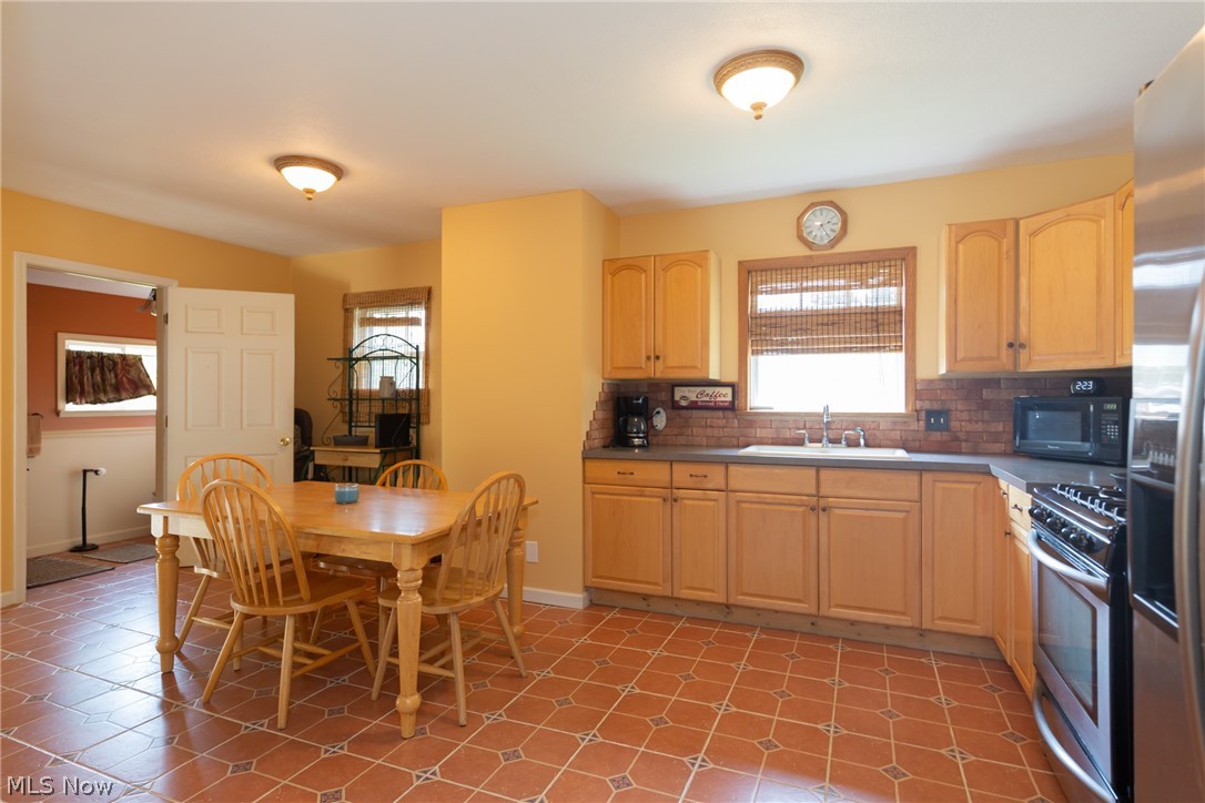 1518 Krumroy Road Akron, OH 44306 - Photo 8 of 35 Large Eat In Kitchen with Ceramic Tile and Stainless Steel Appliances