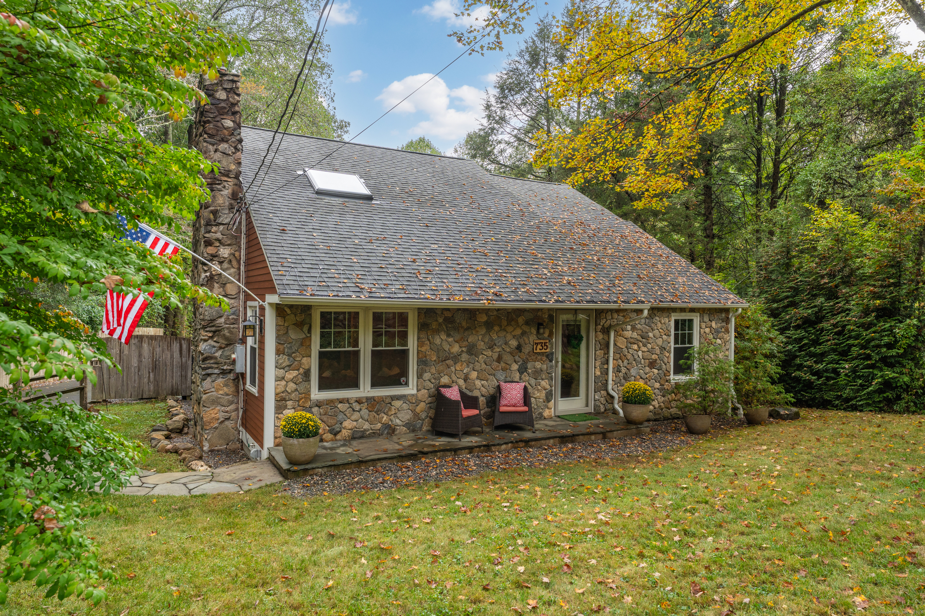 735 Opening Hill Road Madison, CT 06443 - Photo 1 of 39 a backyard of a house with yard and outdoor seating