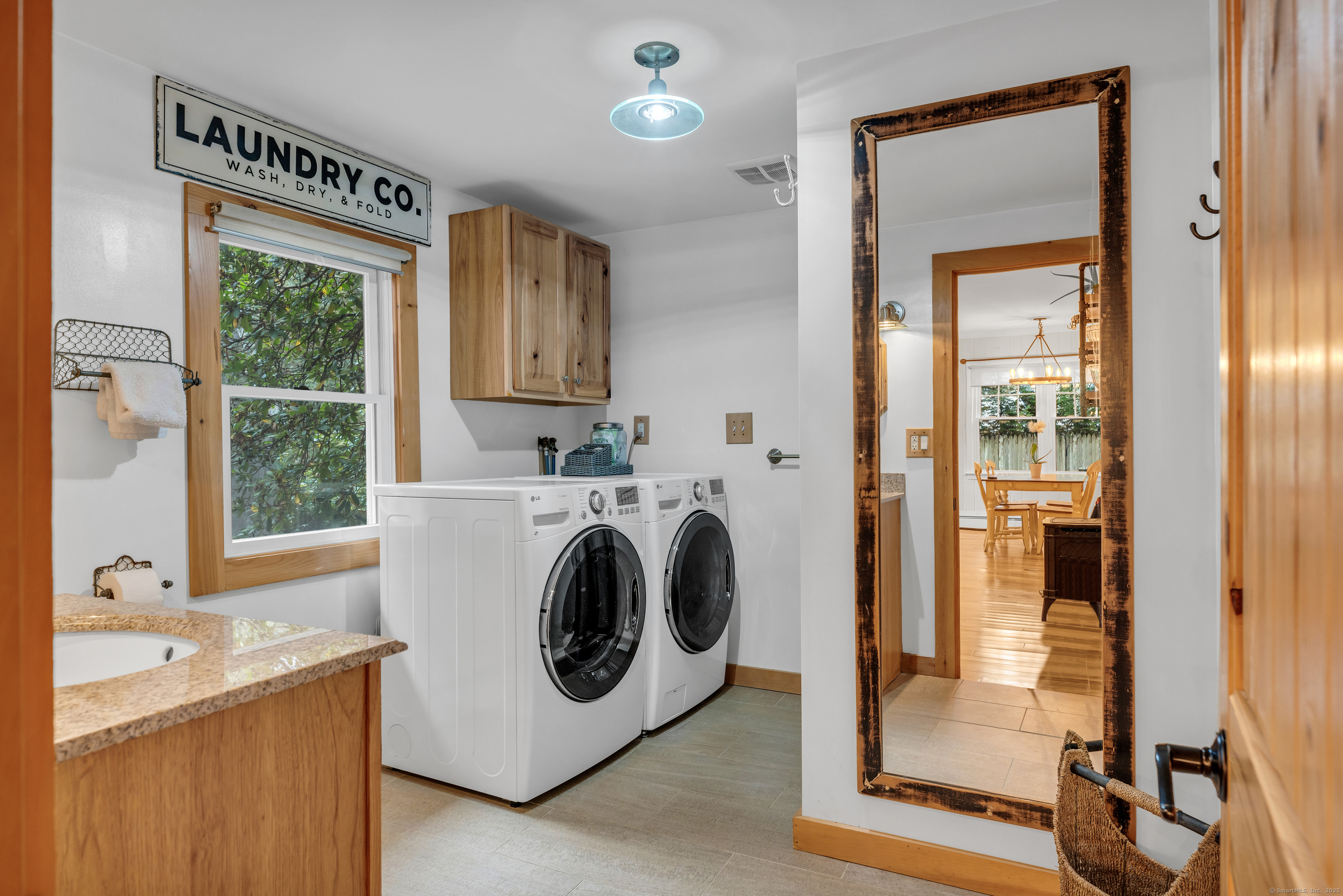735 Opening Hill Road Madison, CT 06443 - Photo 12 of 39 a utility room with wooden floor washer and dryer