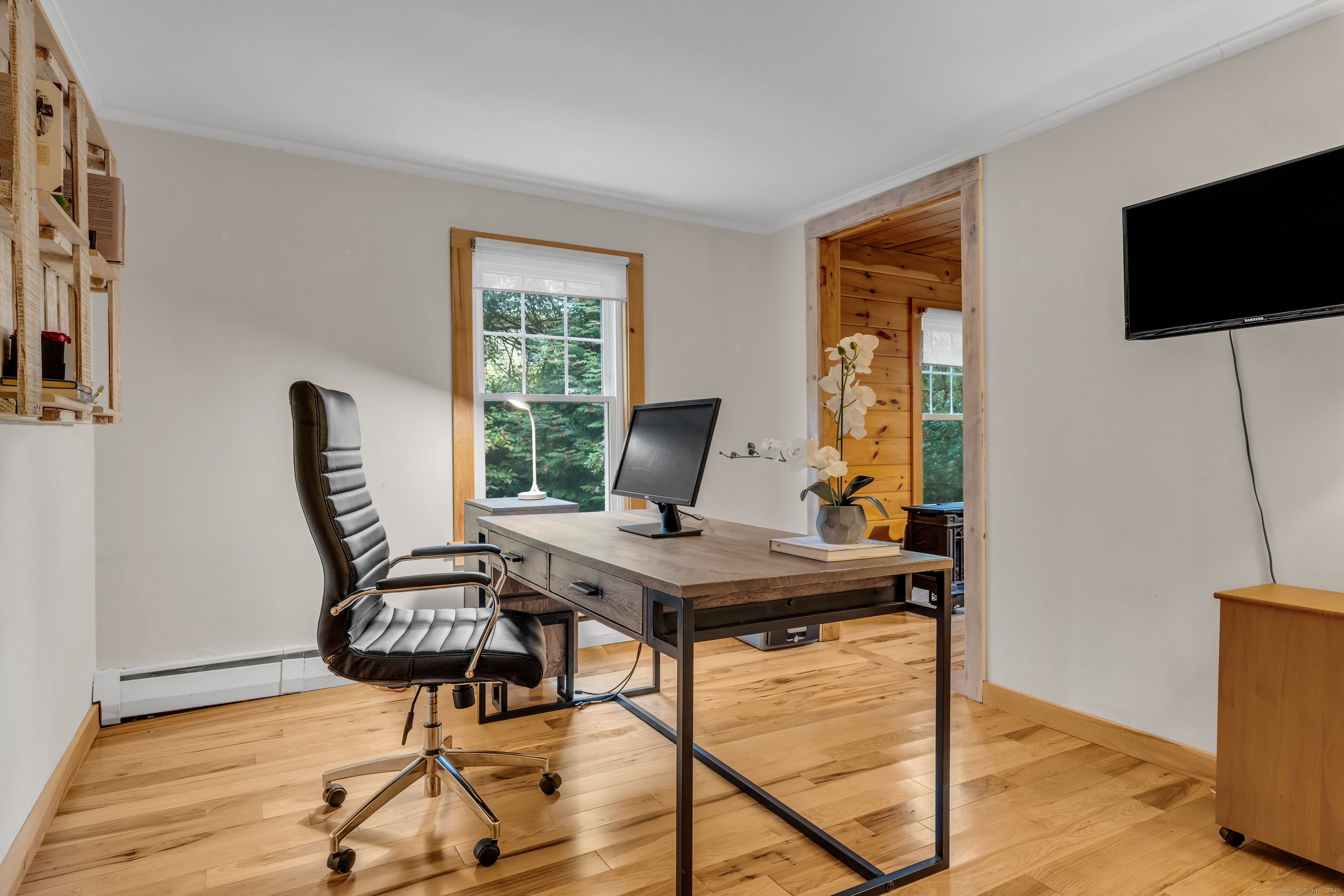 735 Opening Hill Road Madison, CT 06443 - Photo 14 of 39 a view of a workspace with furniture and a window