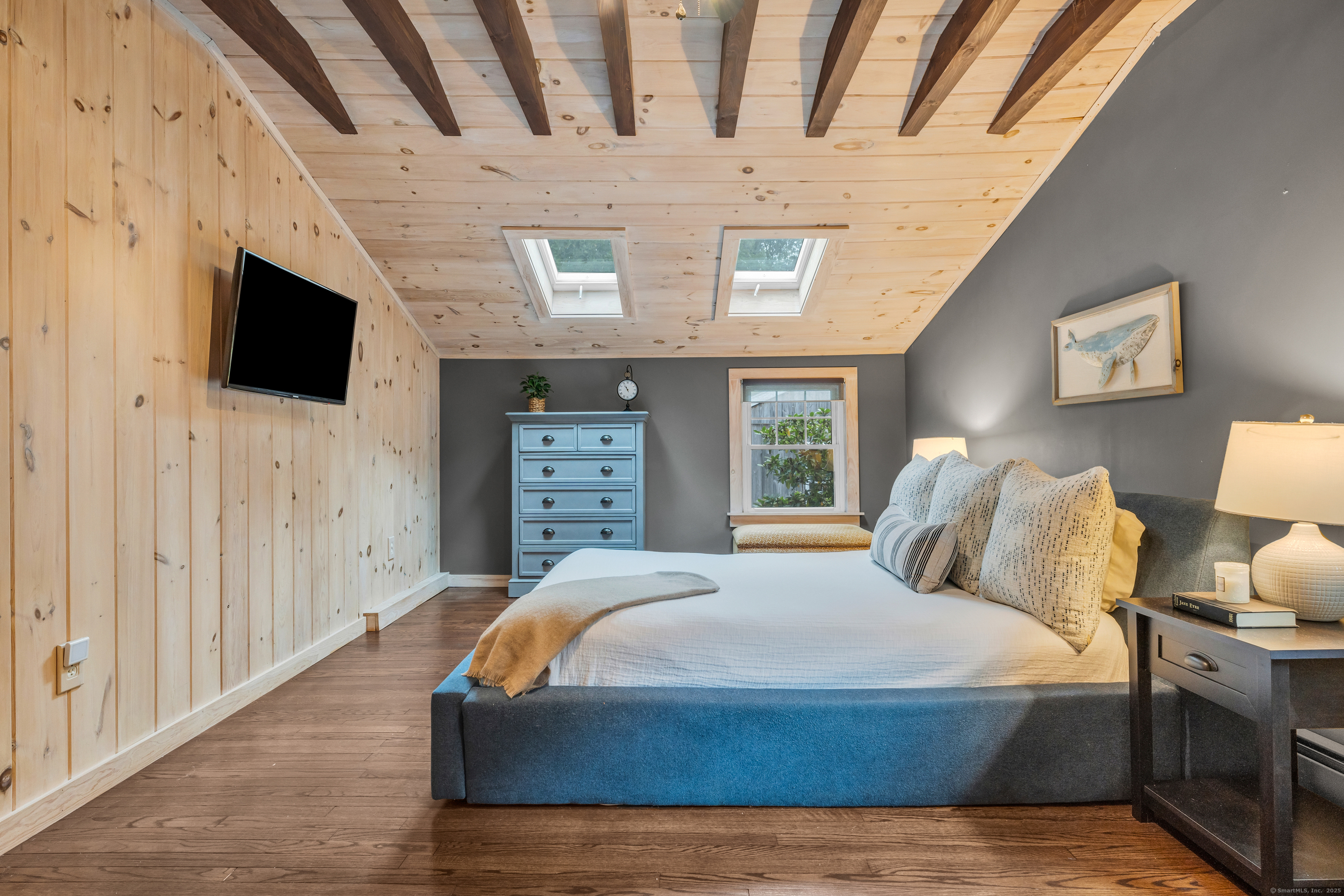 735 Opening Hill Road Madison, CT 06443 - Photo 17 of 39 a spacious bedroom with a bed and a flat screen tv