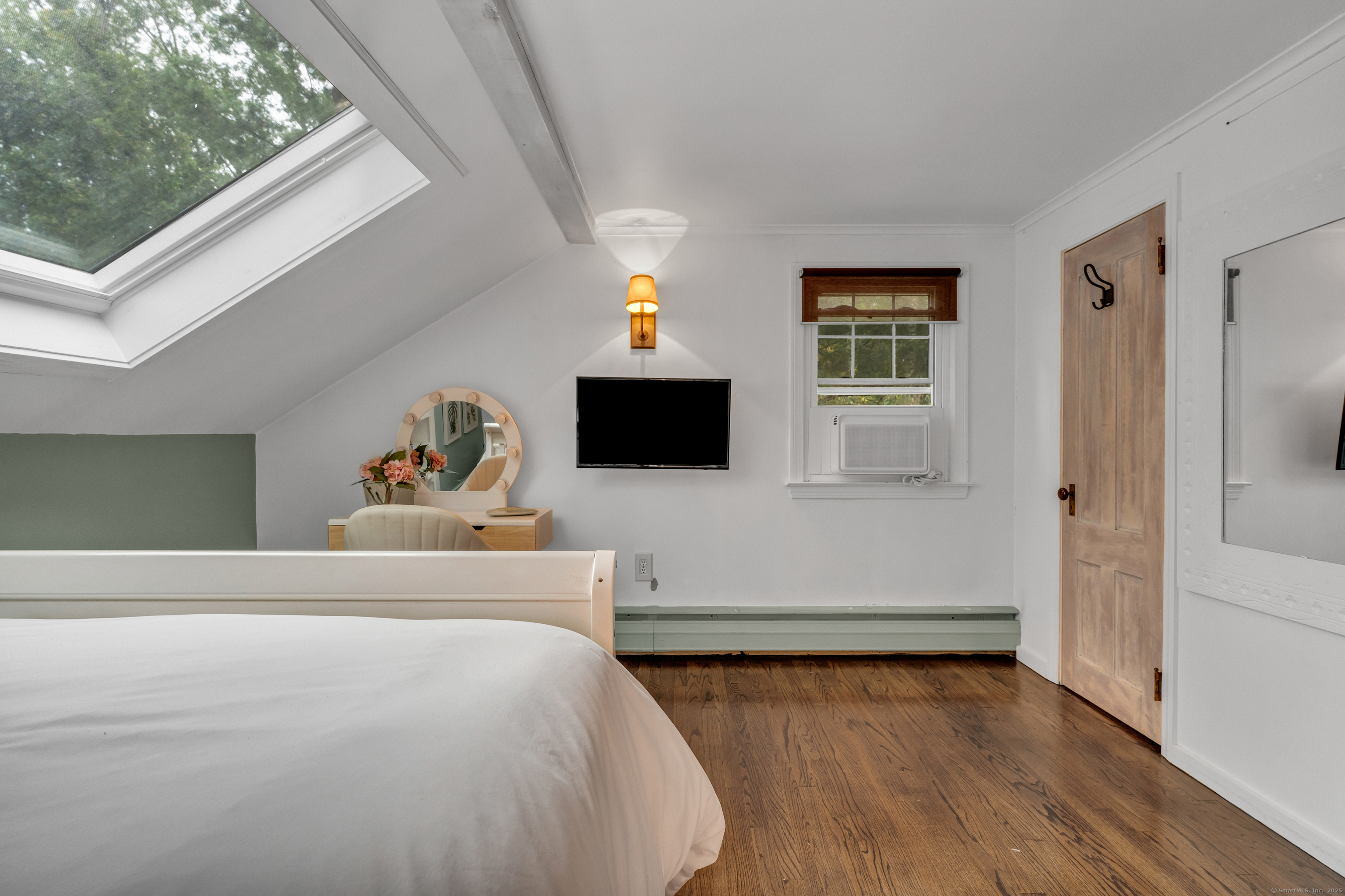 735 Opening Hill Road Madison, CT 06443 - Photo 20 of 39 a bedroom with a bed and a flat screen tv