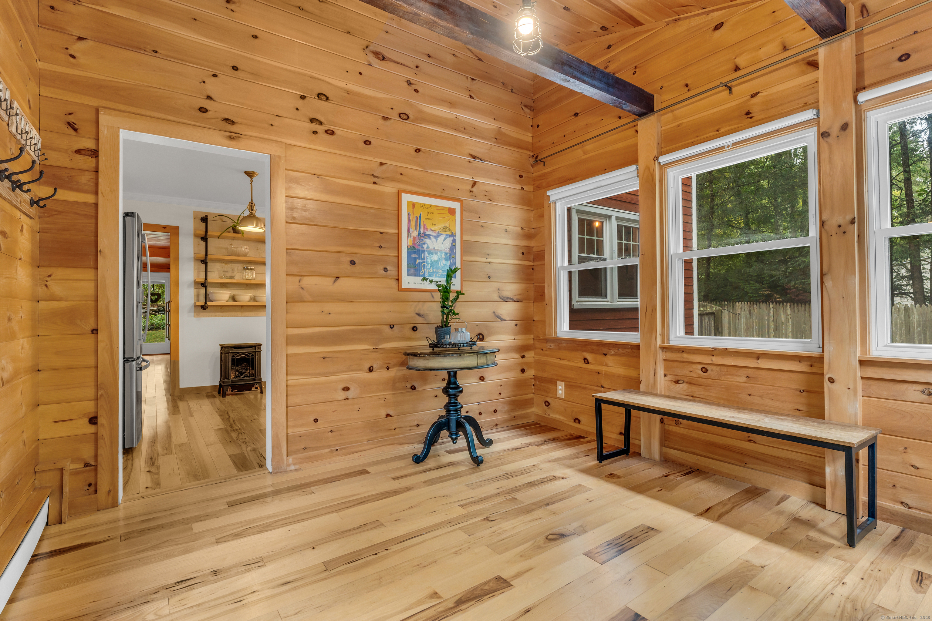 735 Opening Hill Road Madison, CT 06443 - Photo 24 of 39 a view of a livingroom with a chair and a fireplace