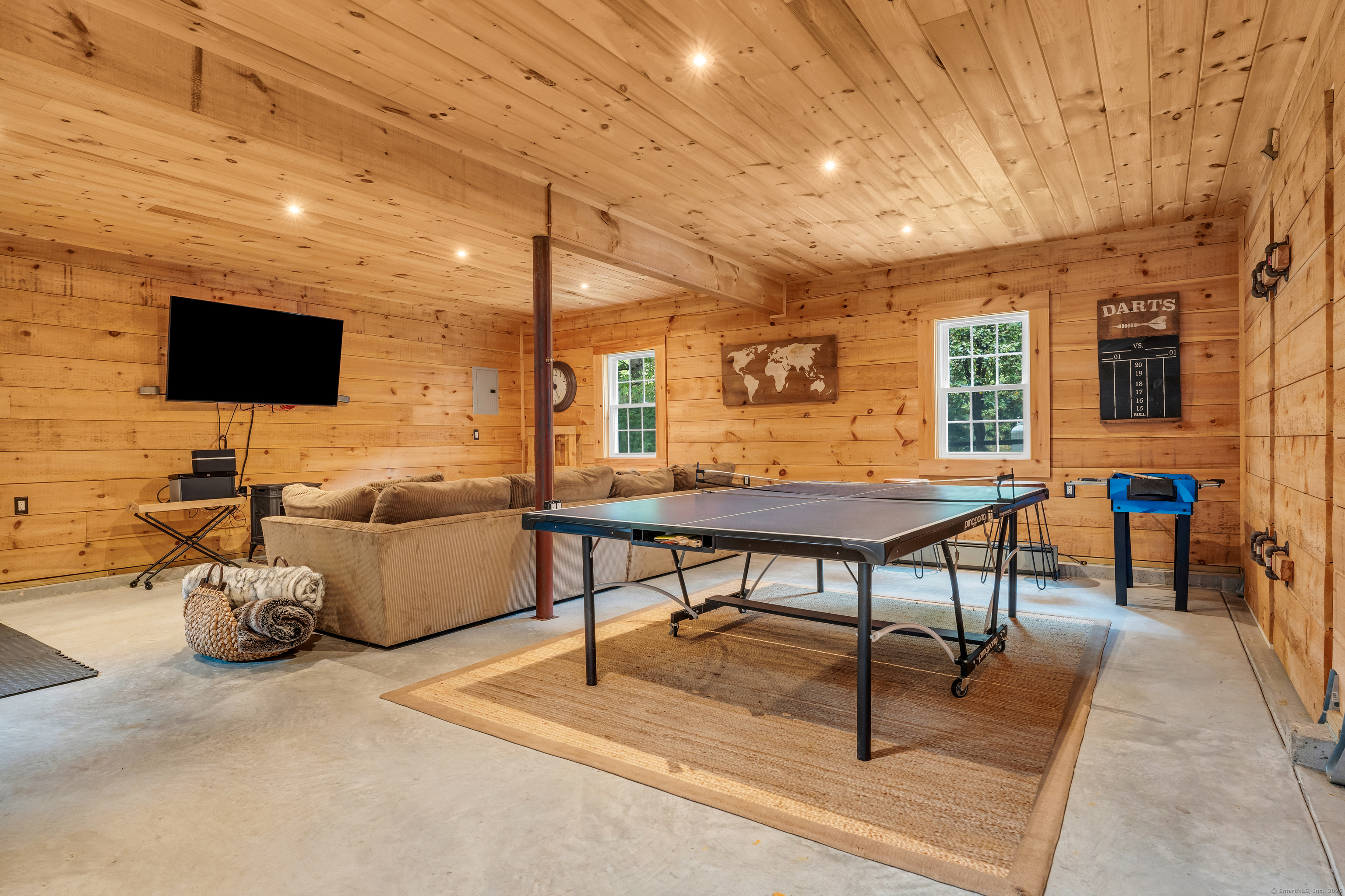 735 Opening Hill Road Madison, CT 06443 - Photo 27 of 39 a living room with furniture and a flat screen tv