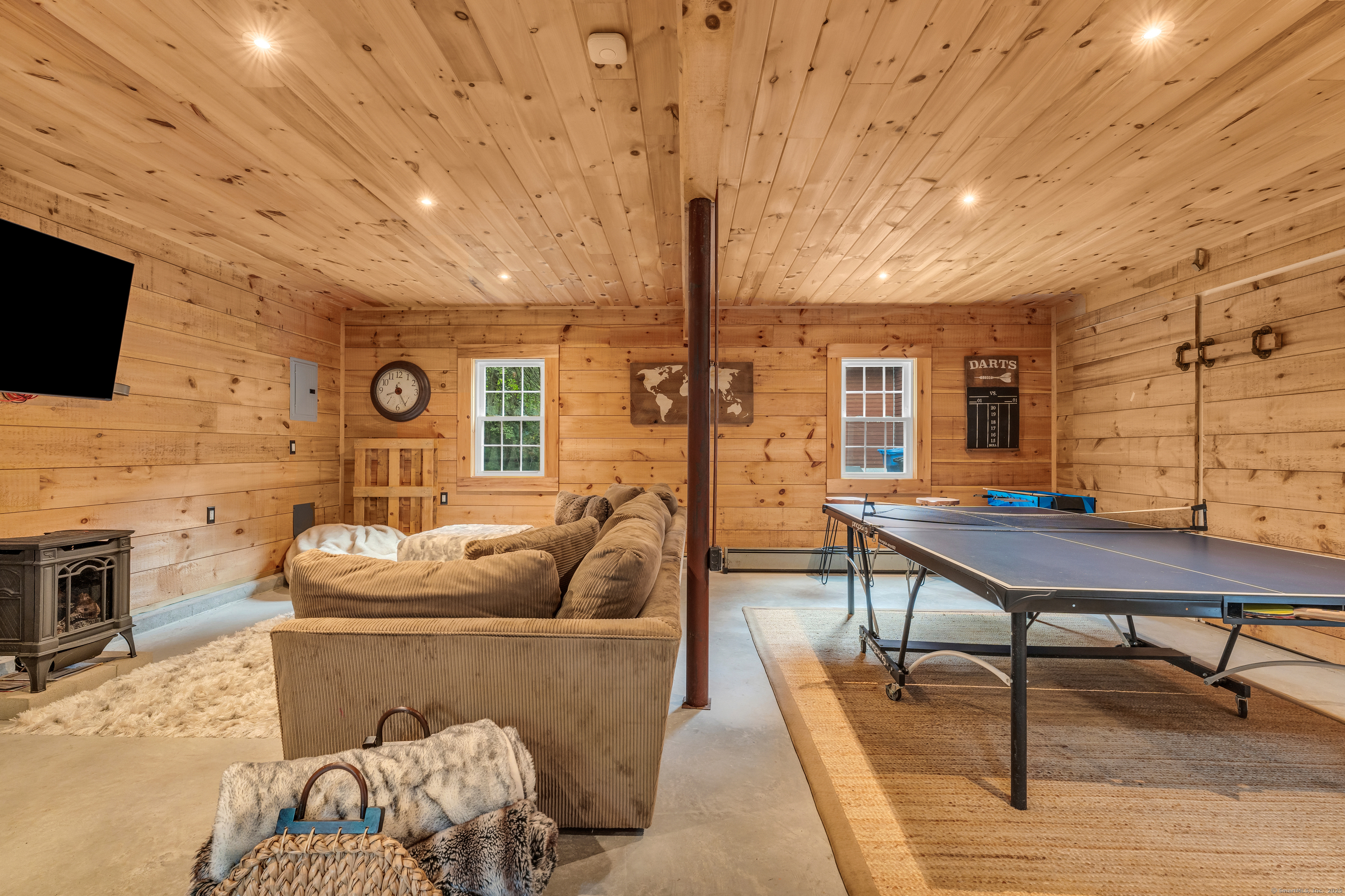 735 Opening Hill Road Madison, CT 06443 - Photo 28 of 39 a living room with furniture and a flat screen tv