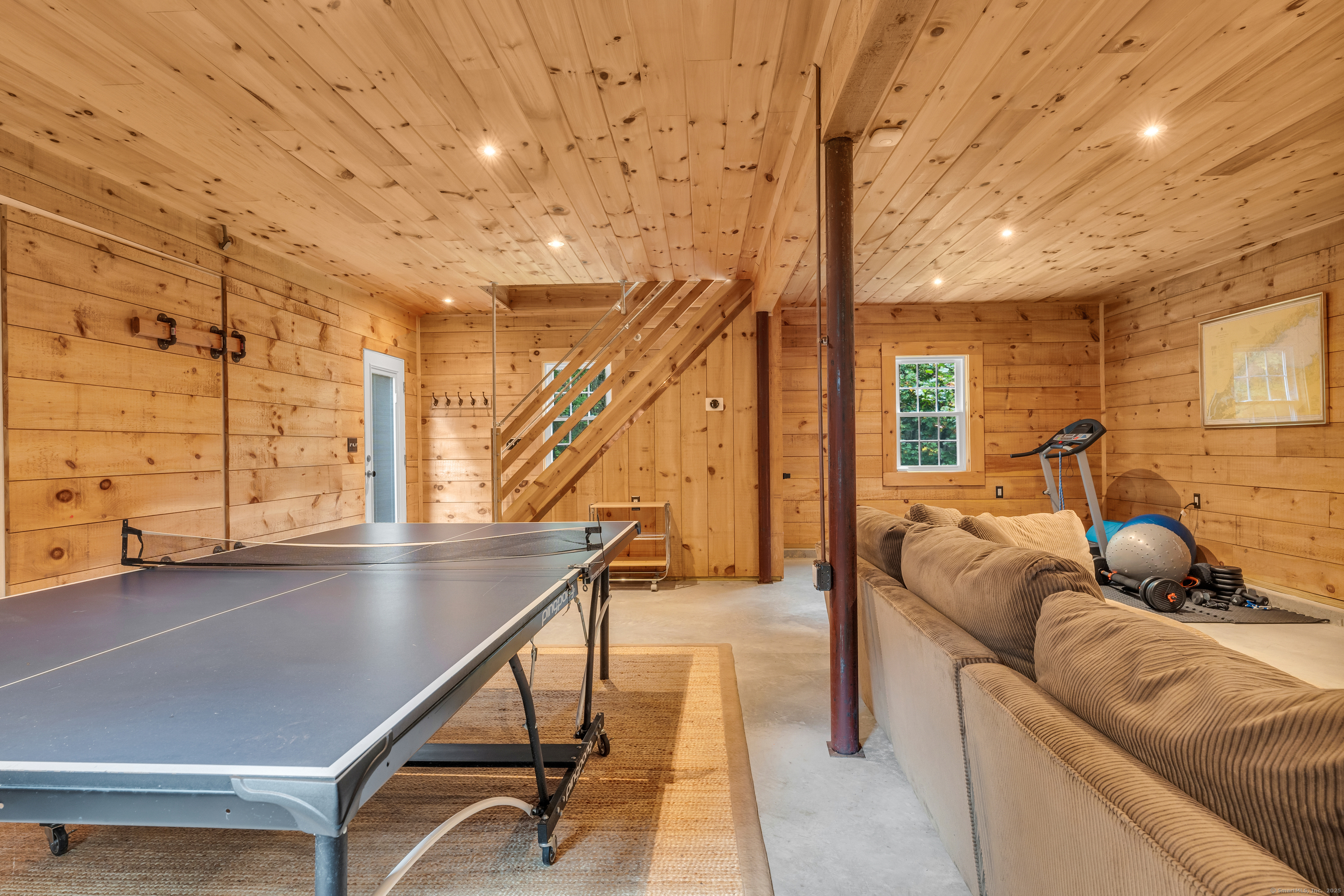 735 Opening Hill Road Madison, CT 06443 - Photo 29 of 39 a living room with couch and a table