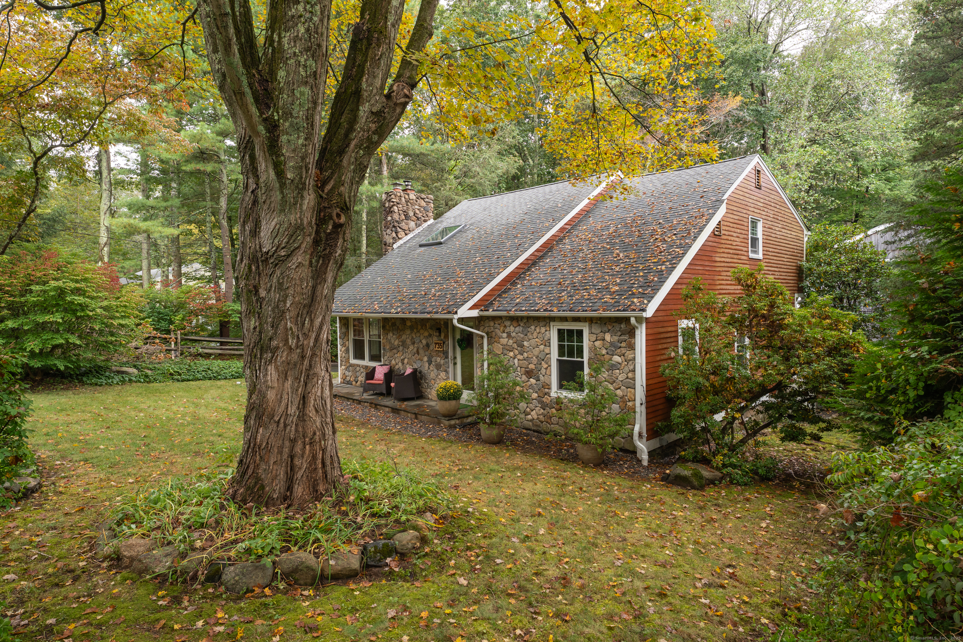735 Opening Hill Road Madison, CT 06443 - Photo 3 of 39 a backyard of a house with lots of green space
