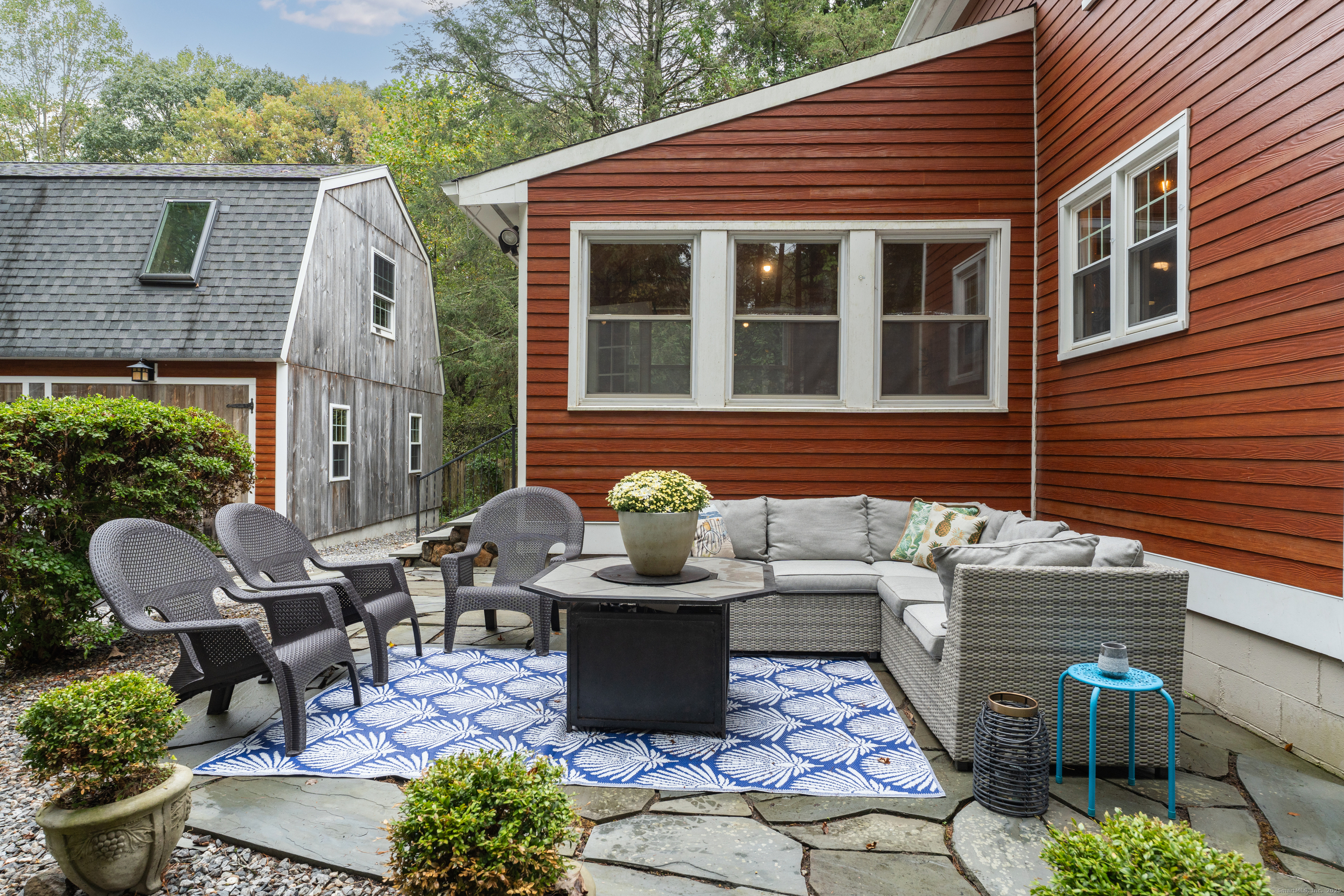 735 Opening Hill Road Madison, CT 06443 - Photo 32 of 39 a view of a patio with chair and tables back yard of the house