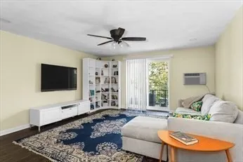 a view of a livingroom with furniture and a flat screen tv