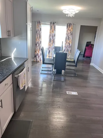 a bedroom with a bed and a mirror