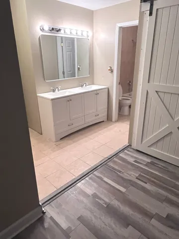 a view of a balcony with wooden floor