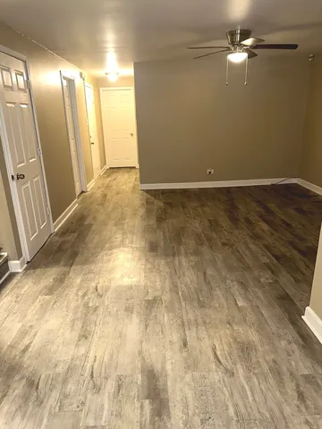 a white toilet sitting next to a shower curtain