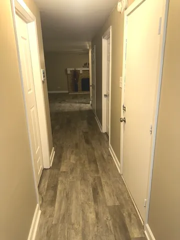 a bathroom with a sink mirror vanity and toilet