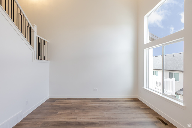 4812 Heartwood Road, Unit 424 Mapleton, UT 84664 - Photo 9 of 20 Spare room featuring dark wood-style floors and baseboards